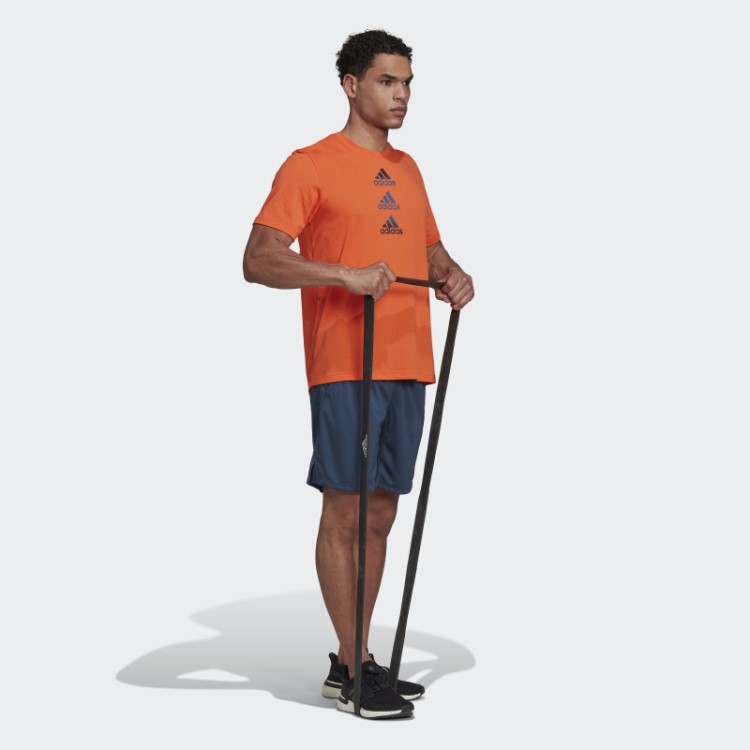Camiseta Adidas Laranja Projetada Para Mover O Logotipo