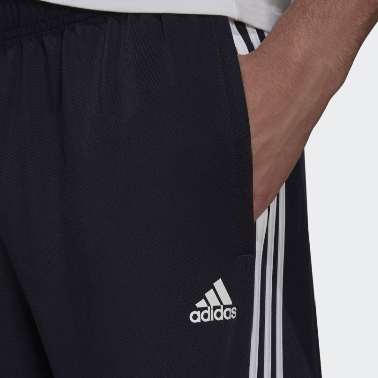 Calça Esportiva Com As Três Listras Adidas Essentials Warm Up Ink