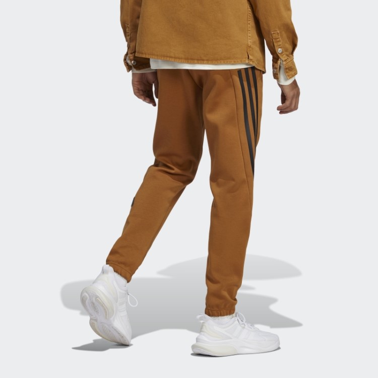 Calça Adidas Future Icons Com As Três Listras Bronze